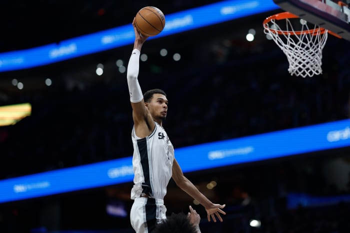 Jan 20, 2024; Washington, District of Columbia, USA; San Antonio Spurs center Victor Wembanyama (1) dunks the ball over Washington Wizards forward Marvin Bagley III (35) prior to being called for an offensive foul in the second half at Capital One Arena.